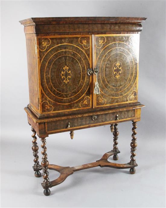A William and Mary laburnum oyster veneered and crossbanded cabinet on stand, W.3ft 4in. D.1ft 6in. H.4ft 11in.